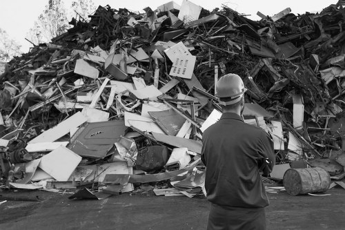 Professionals clearing out a cluttered garage in Kensal Green