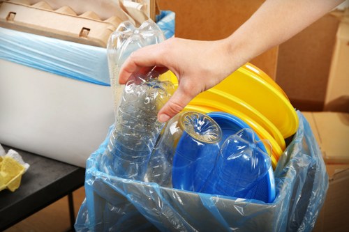 Professional team assessing garage clutter in West Hampstead